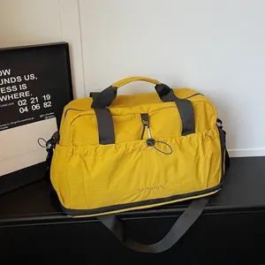 Large yellow waterproof travel duffel bag with dry-wet separation for gym and sports