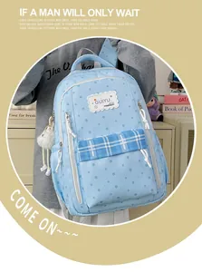 Light blue school backpack with star pattern and checkered front pocket for students