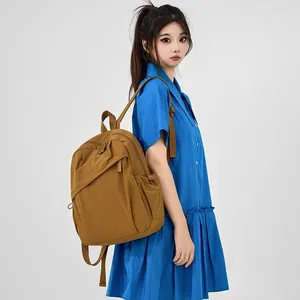 Korean style minimalist brown nylon backpack for women with large capacity on model