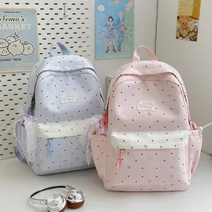 Japanese style cute backpacks with lace bows and polka dot pattern.