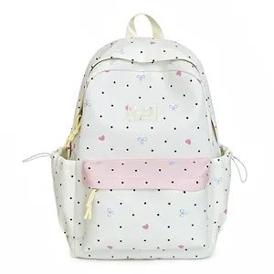Kawaii white polka dot backpack with pink bow and heart patterns for school girls