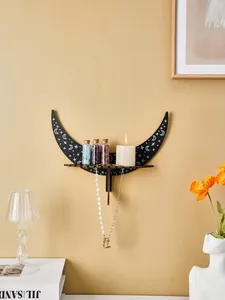 Crescent moon wall shelf for crystals and candles in a cozy room setting