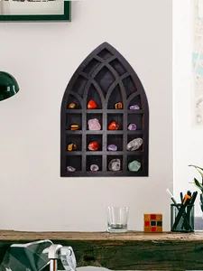 Gothic arch wooden wall shelf displaying various colorful crystals and stones on white wall