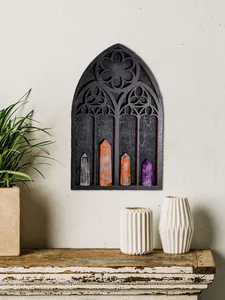Gothic cathedral window wall shelf displaying crystals in a minimalist home interior