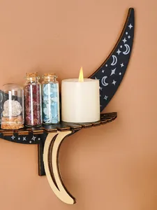Decorative moon and star wooden wall shelf displaying glass crystal jars and a candle