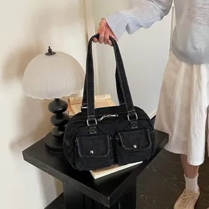 Large capacity black denim Boston bowling bag featuring contrast stitching and shoulder straps