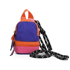 Vibrant color-block mini backpack pouch for earphones and lipstick with patterned lanyard