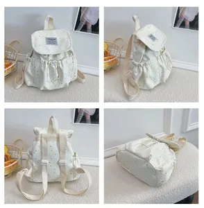 Multi-angle views of a white Japanese-style small backpack with silver star patterns