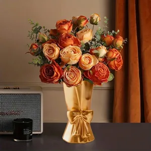 Creative golden resin vase in hand-held bouquet shape with bow detail decoration
