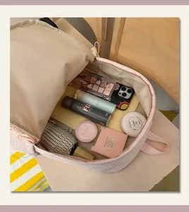 Detail of pink checkered school backpack interior showing its large storage capacity.