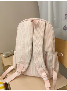Detailed back view of pink gingham backpack with adjustable straps and back zipper pocket