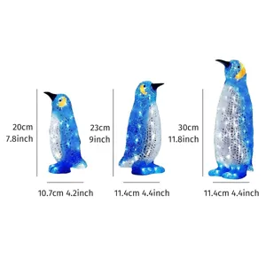 Set mit drei leuchtenden blauen Pinguin-Gartensteckern in verschiedenen Größen für außen