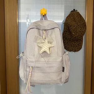 Purple checkered school backpack with bow and star charm, large capacity bag.