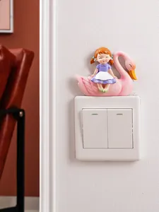 Hand-painted resin girl on pink swan ornament shown as a light switch decoration.