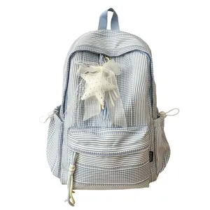 Blue and white striped plaid school backpack with star and bow charm accessory
