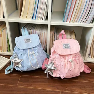 Japanese style mini backpacks with star patterns in light pink and blue colors