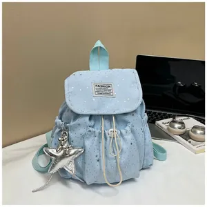 Japanese style mini blue backpack with silver star pattern and balloon dog charm