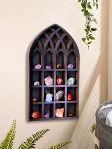 Close-up detail of Gothic arch wooden wall display shelf showing crystals and minerals