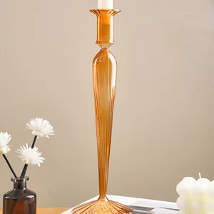 Elegant orange ribbed glass candle holder for festive wedding and celebration decor