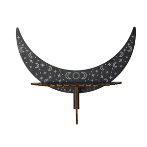 Black wooden crescent moon wall shelf with carved star patterns for bohemian home decor