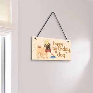 Detailed view of wooden hanging plaque featuring a cartoon pug and happy birthday dog text