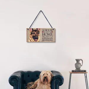 Detail of wooden German Shepherd dog wall plaque hanging in a cozy living room setting.