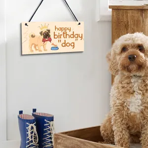 Wooden hanging sign featuring a cute pug illustration and happy birthday dog message