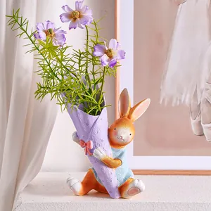 Close-up of cute resin rabbit figurine holding purple flower bouquet vase for Easter decor