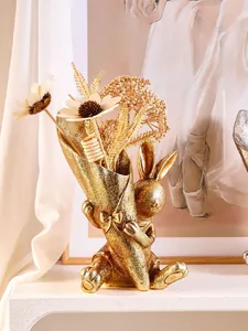 Detailed view of the creative golden rabbit resin vase with elegant floral decor