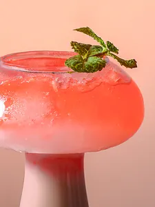 Detailed macro shot of the creative mushroom-shaped cocktail glass with slushy drink