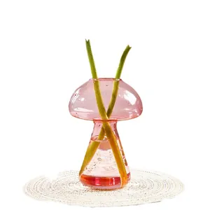 Vase champignon en verre rose transparent, joli support de plante de bureau minimaliste.