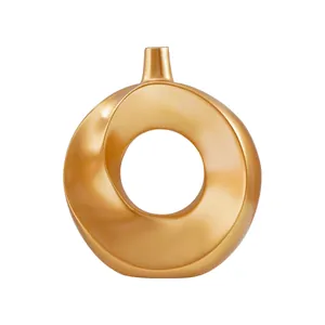 Moderne nordische goldene kreisförmige Donut-Vase für minimalistisches Heimdekor und Styling