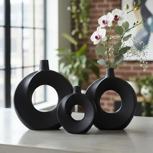 Minimalistische kreisförmige schwarze Keramikvasen für moderne Heimdekoration