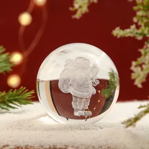 Macro view of crystal ball featuring 3D laser engraved Santa Claus Christmas decor