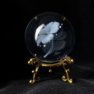 Macro view of crystal ball with intricate laser engraved four-leaf clover for home