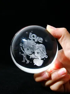 Macro view of 3D laser engraved anime couple inside a crystal ball with love text