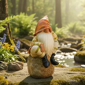 Detailed view of a bearded garden gnome statue sitting on a rock by a stream