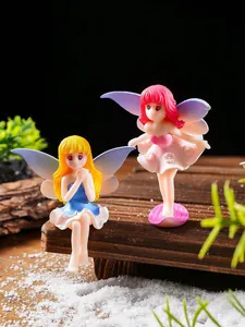 Detail of cute miniature fairy figurines with wings for garden micro landscape decor
