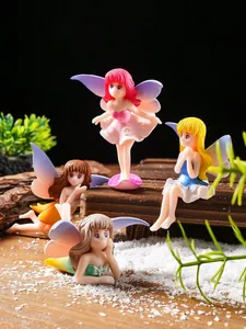Detailed view of four cute cartoon fairy figurines in a miniature garden landscape