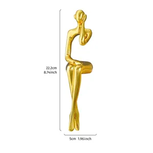 Detailed view of modern gold-plated thinker sculpture showing dimensions of 22.2cm by 5cm