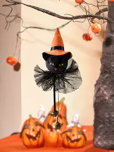 Black plush cat Halloween ornament with orange witch hat and bells for festive decor