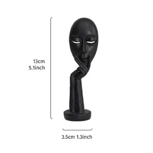 Abstract black resin 'Silence is Golden' mask ornament with 13cm height dimensions