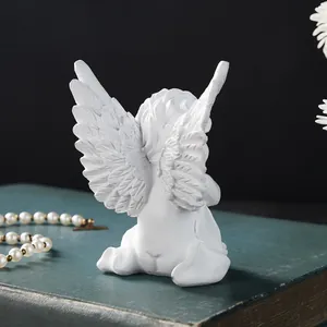 Detailed close-up showing the delicate back wing texture of white resin angel figurine