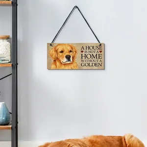 Detail view of a wooden hanging wall sign featuring a Golden Retriever and home quote