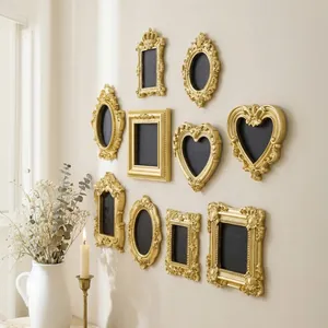 Detailed view of ornate golden European resin frames displayed on an elegant gallery wall