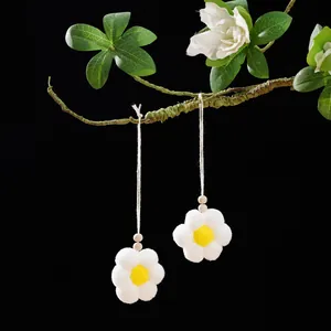 Handmade white pom-pom flower hanging ornaments with wooden beads for bag decoration