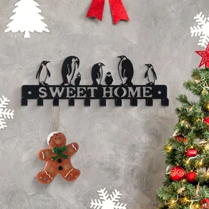 Schluesselanhaenger Wandhalterung aus Metall mit Pinguin Design und Sweet Home Text Deko.