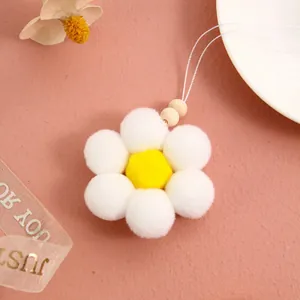 Handmade white pom-pom daisy charm with wooden beads for bag or car decoration