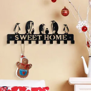 Minimalistischer schwarzer Eisen-Schlüsselhaken mit Pinguin-Silhouetten für Wanddekor