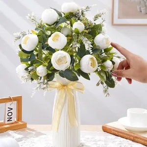 Elegant white artificial peony bouquet in a ribbed vase for home and wedding decor.